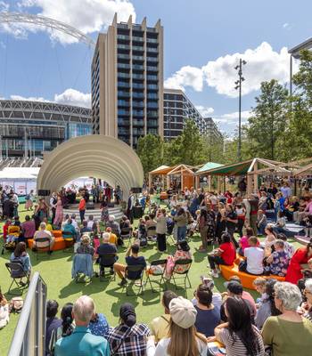 People attending Wembley events at Samovar Space on Olympic Way during summer