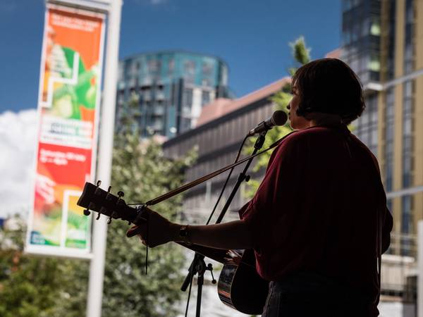 Lucy May Walker playing at International Busking Day 2021 in Wembley Park