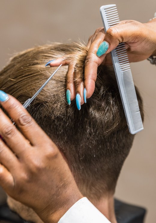 Men getting his haircut at Chop Chop in Wembley Park