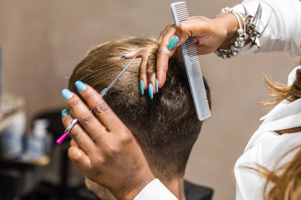 Men getting his haircut at Chop Chop in Wembley Park