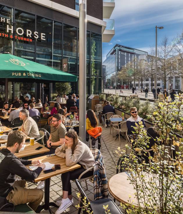 People enjoying White Horse Pub in Wembley Park