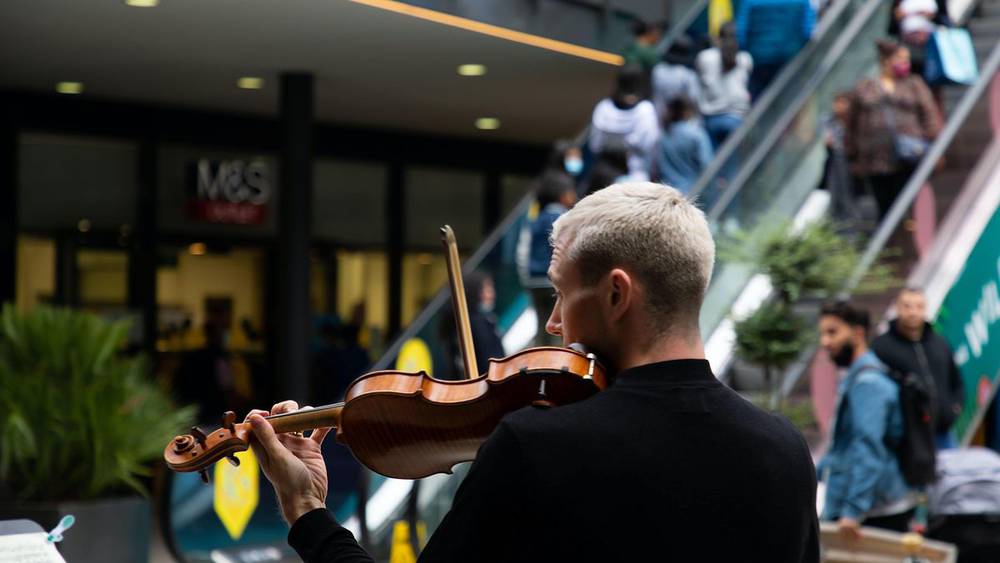 RPO playing violin in London Designer Outlet at Wembley Park