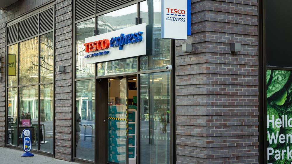 The exterior of Tesco Express in Wembley Park, showing the shopfront and entrance.