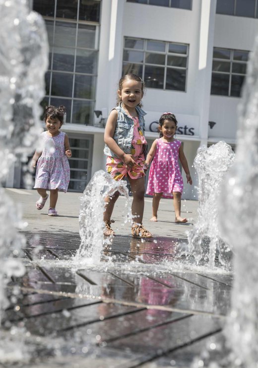 Kids playing in the fountain outside The SSE Arena, Wembley at Wembley Park