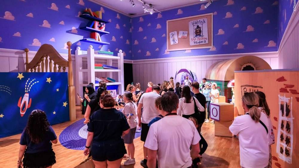 Crowds exploring Andy’s Room from Toy Story inside the Mundo Pixar Exhibition London at Wembley Park.