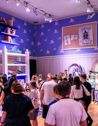 Nemo character among vibrant coral reef sculptures and underwater scenery at the Mundo Pixar Exhibition London. The immersive Finding Nemo zone featur