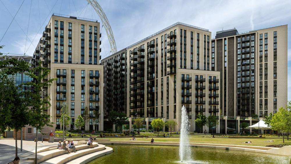 People relaxing in Union Park South at Wembley Park, showing everyday residential life in a well managed public space.